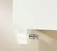 Kermi-Heizkörper in weißer Ausführung, seitlich montiert, mit runder Stellschraube zur Temperaturregelung, an einer hellen Wand angebracht.